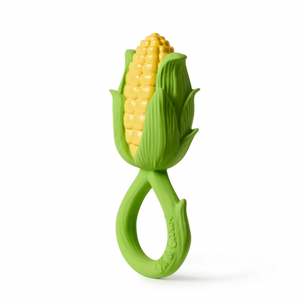 Green corn-shaped teether on a white background