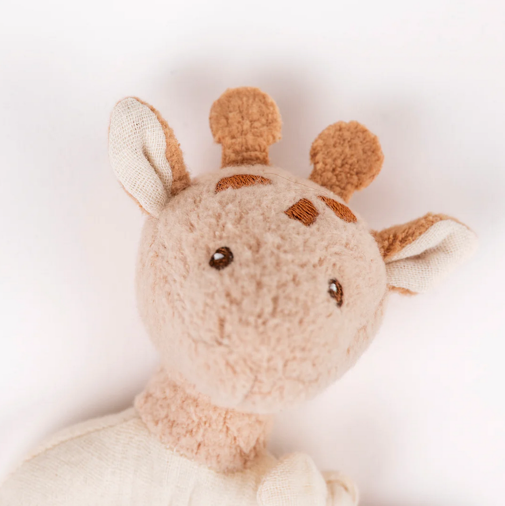 Plush giraffe toy on a white background
