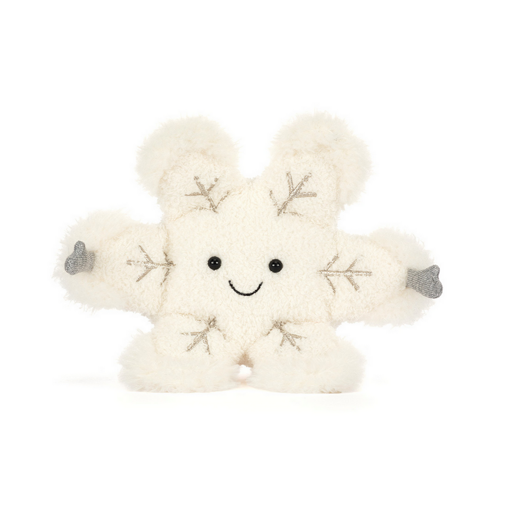 White plush toy with a smiley face and snowflake patterns on a white background