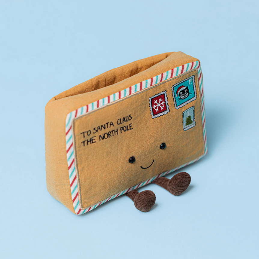 Stuffed letter to Santa Claus with a smiley face on a light blue background