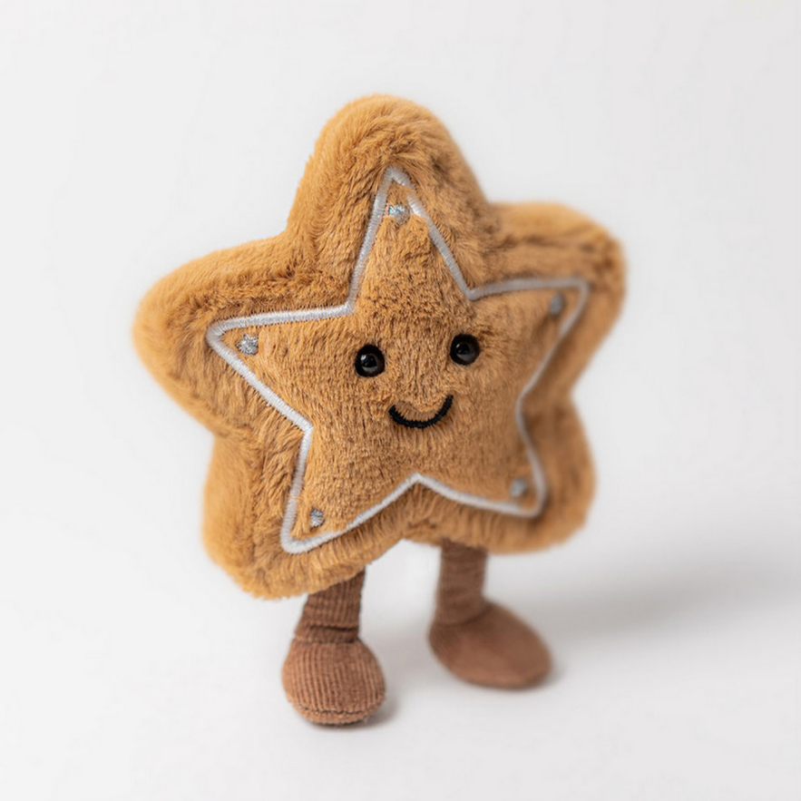 Star-shaped plush toy with a smiling face on a white background