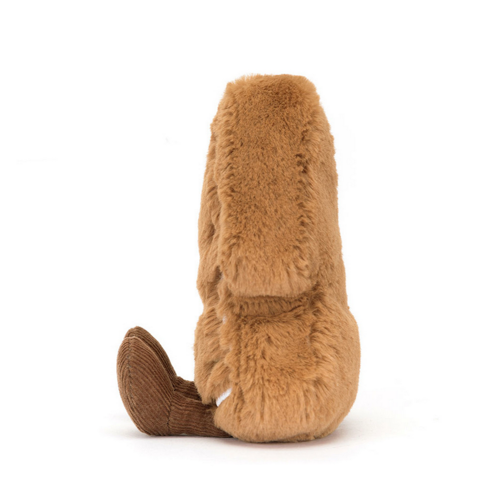 Brown plush toy with a tail on a white background