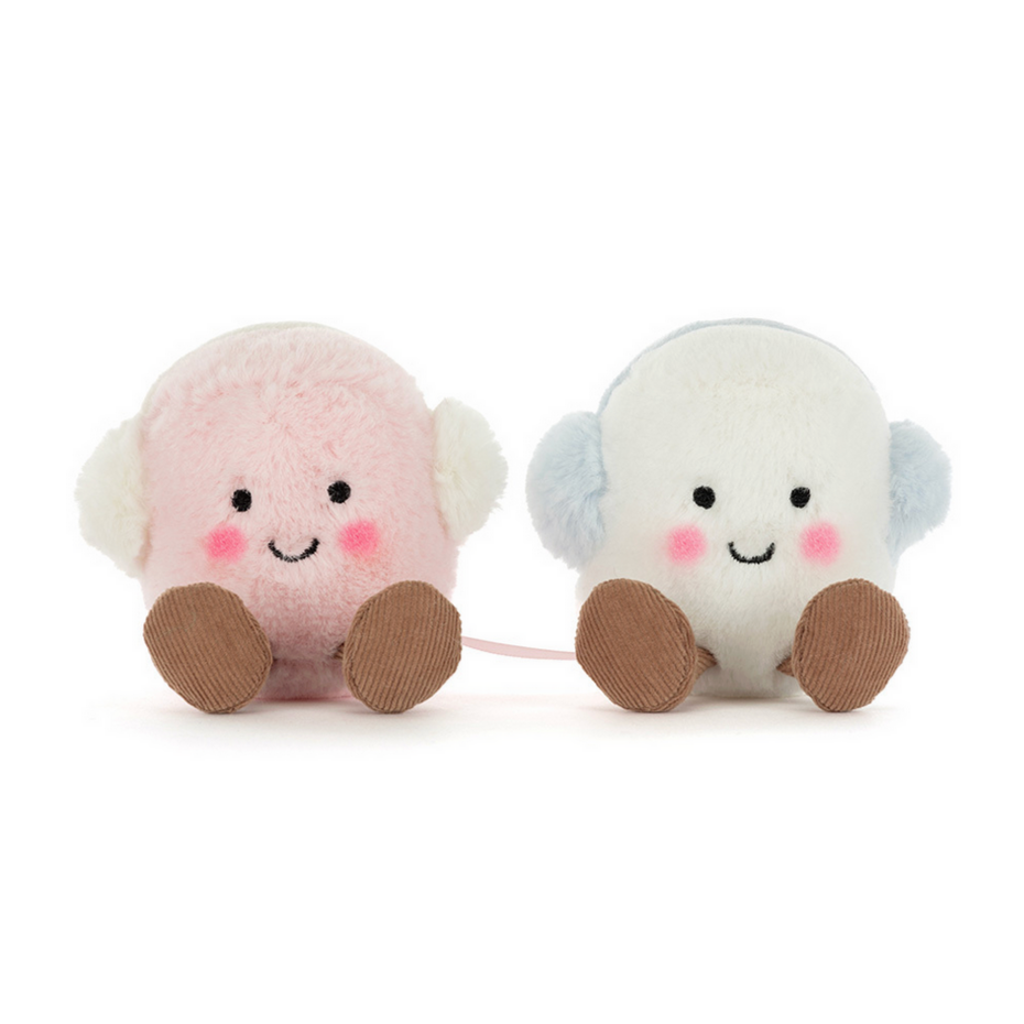 Two cute plush toys resembling marshmallows on a white background