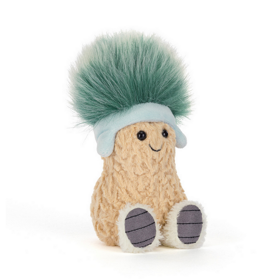 Small plush toy with a green top hat and beige body on a white background