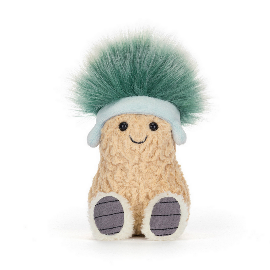 Plush toy resembling a peanut with a green hat on a white background