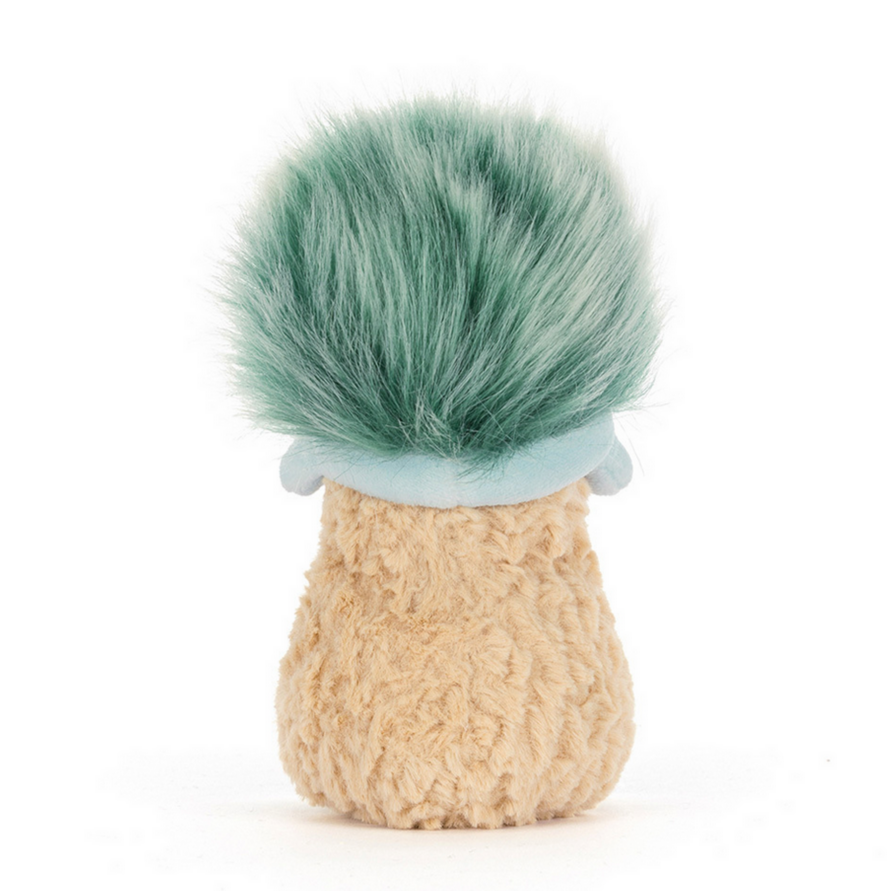 Small plush toy resembling a peanut with a green faux fur top on a white background