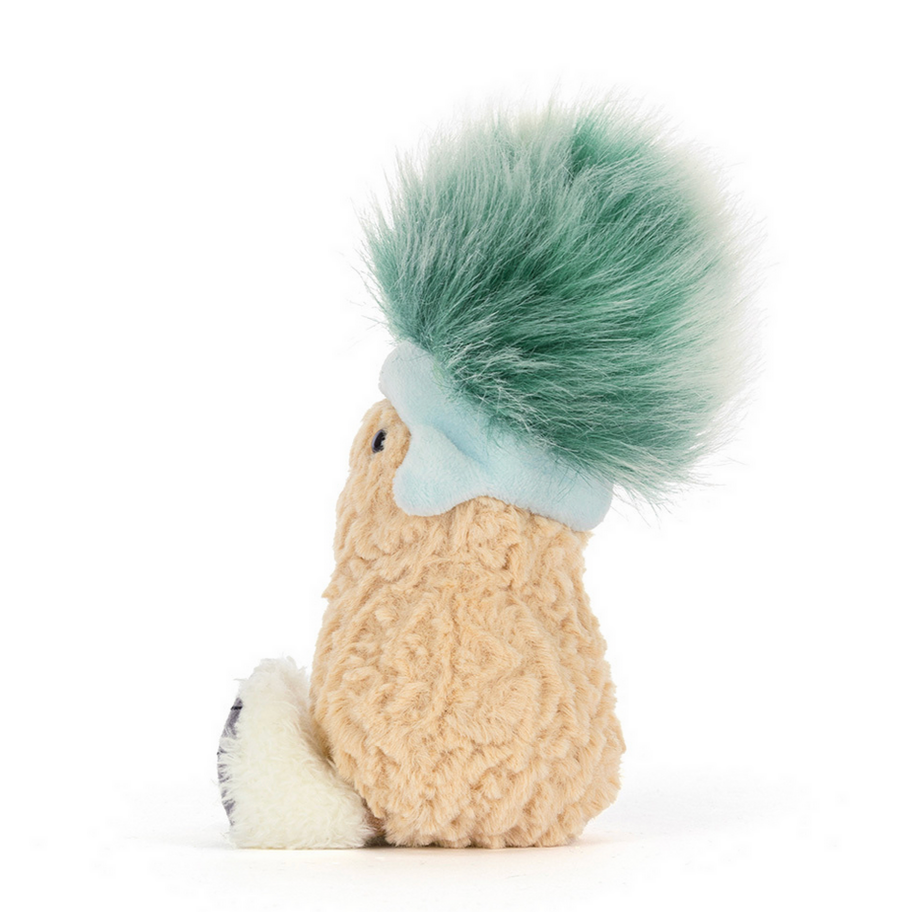 Small plush toy with a green top and beige body on a white background