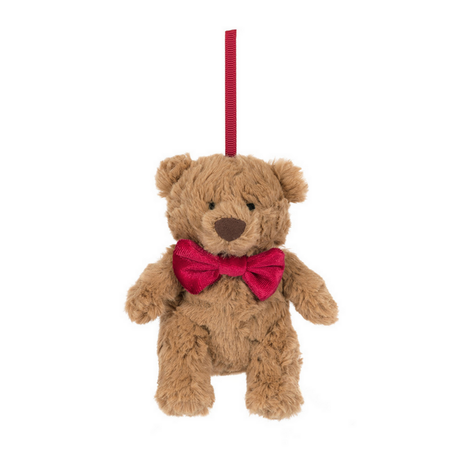 Teddy bear with a red bow tie on a white background