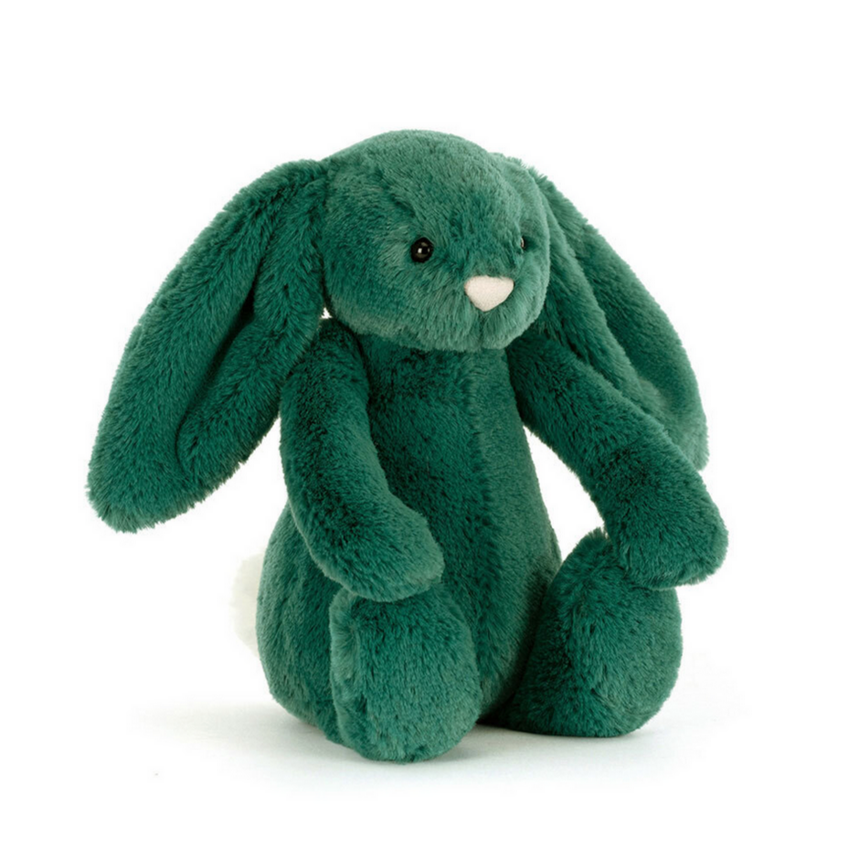 Green plush bunny toy on a white background