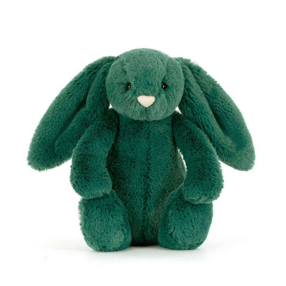 Green plush bunny toy on a white background