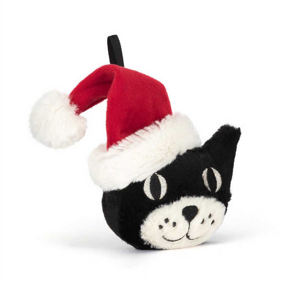 Black cat-shaped toy with a red Santa hat on a white background