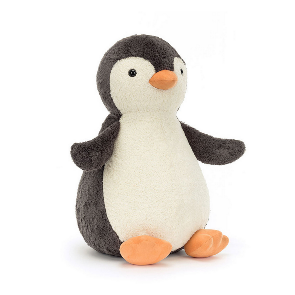 Stuffed penguin toy on a white background