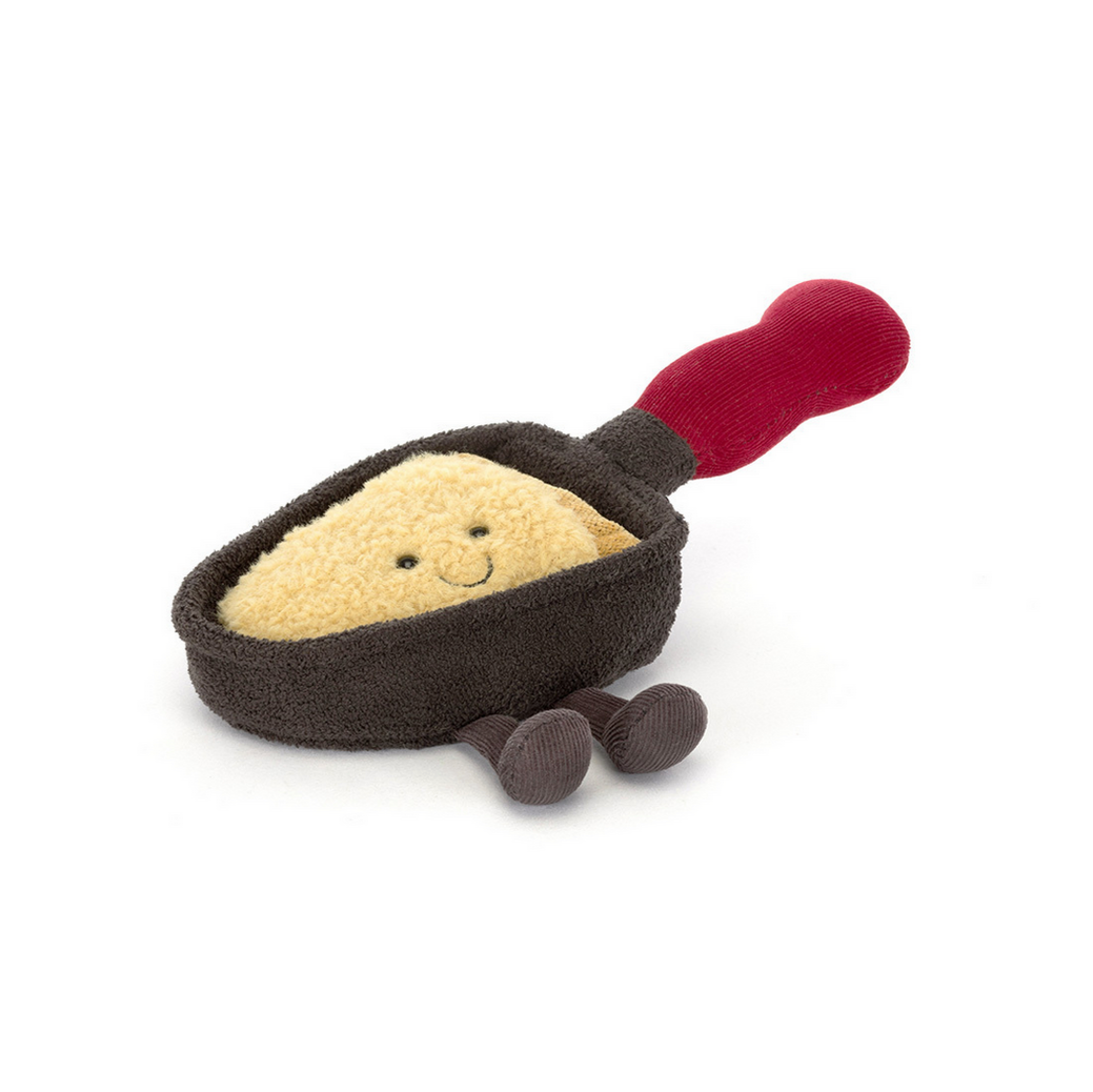 Toy sand pail with sand and red handle on a white background