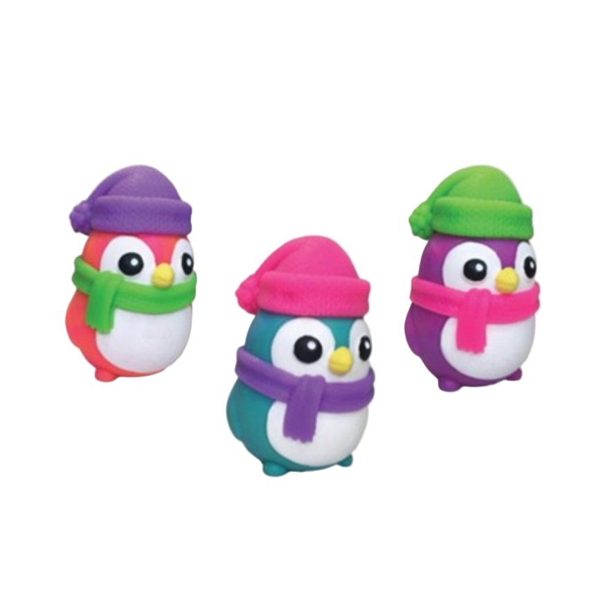 Three colorful penguin toys with hats and scarves.