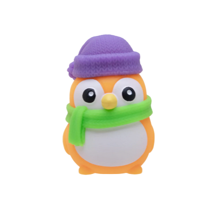 Toy penguin with a purple hat and green scarf on a white background