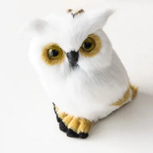 White owl plush toy with brown accents on a white background