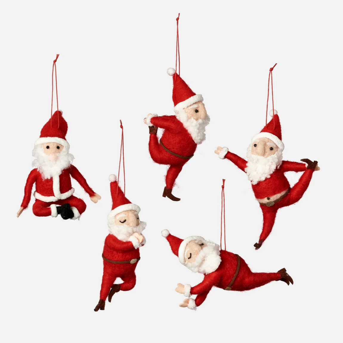 Five red Santa Claus ornaments in various poses on a white background