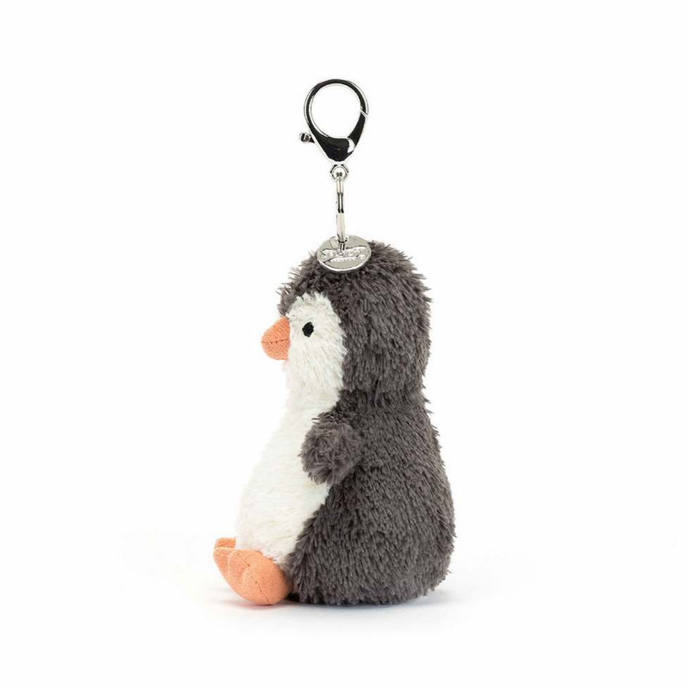 Plush penguin keychain on a white background