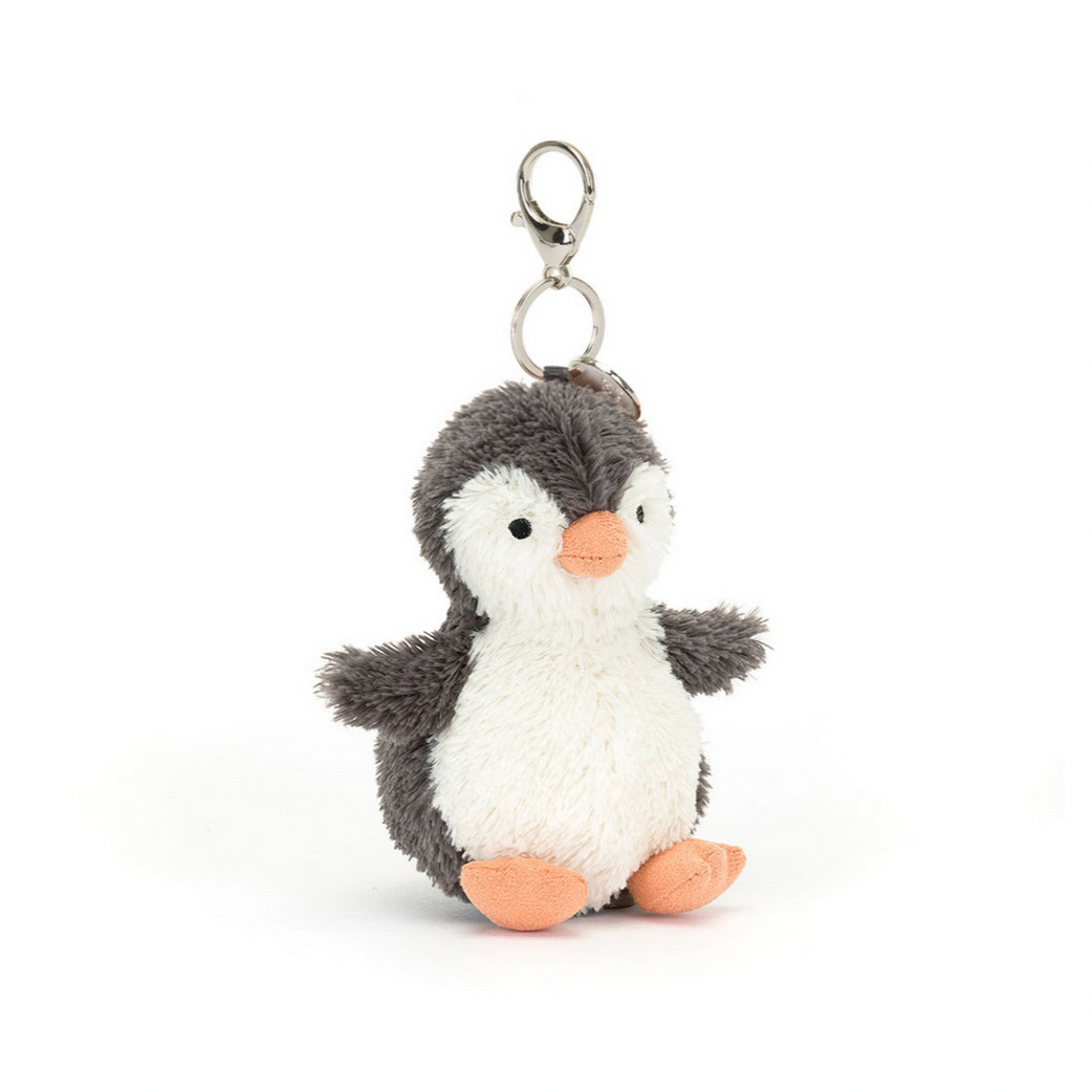 Plush penguin keychain on a white background