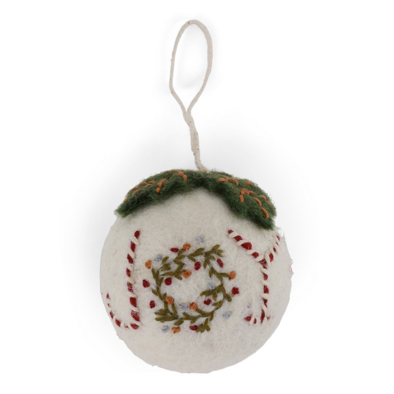 Decorative ornament with embroidered design on a white background