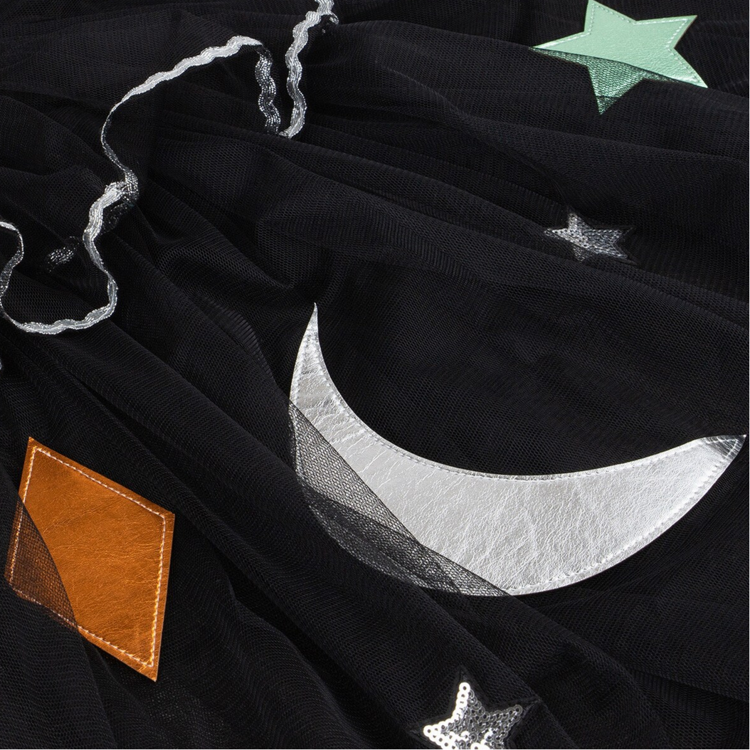 Black fabric with silver crescent moon, star, and brown patch design.