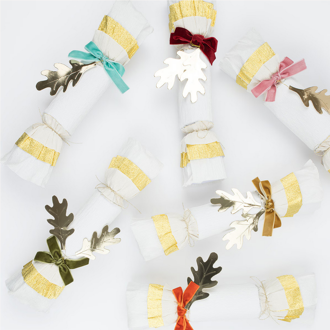 Decorative cracker with colorful bows on a white background