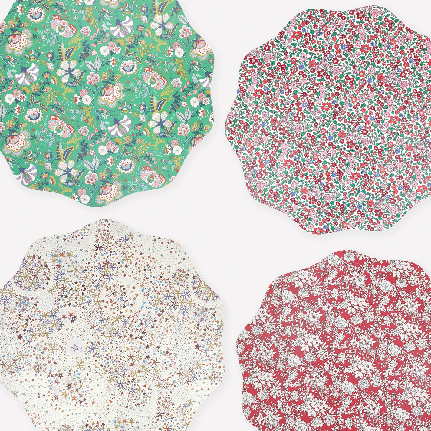 Four floral fabric swatches in different patterns on a white background