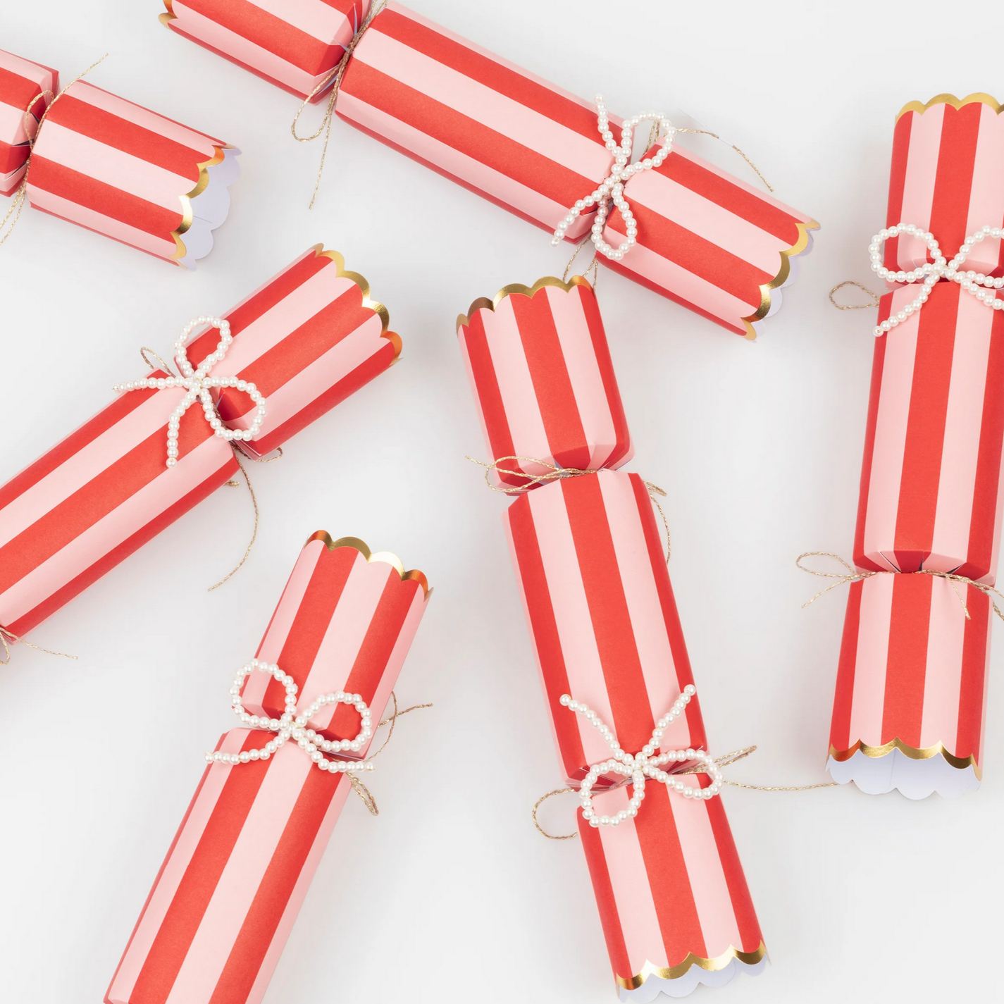 Red and white striped crackers on a white background