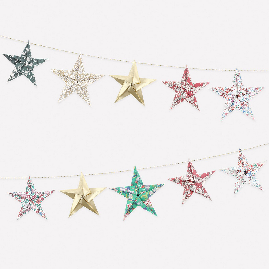 Star-shaped decorations on a string against a white background