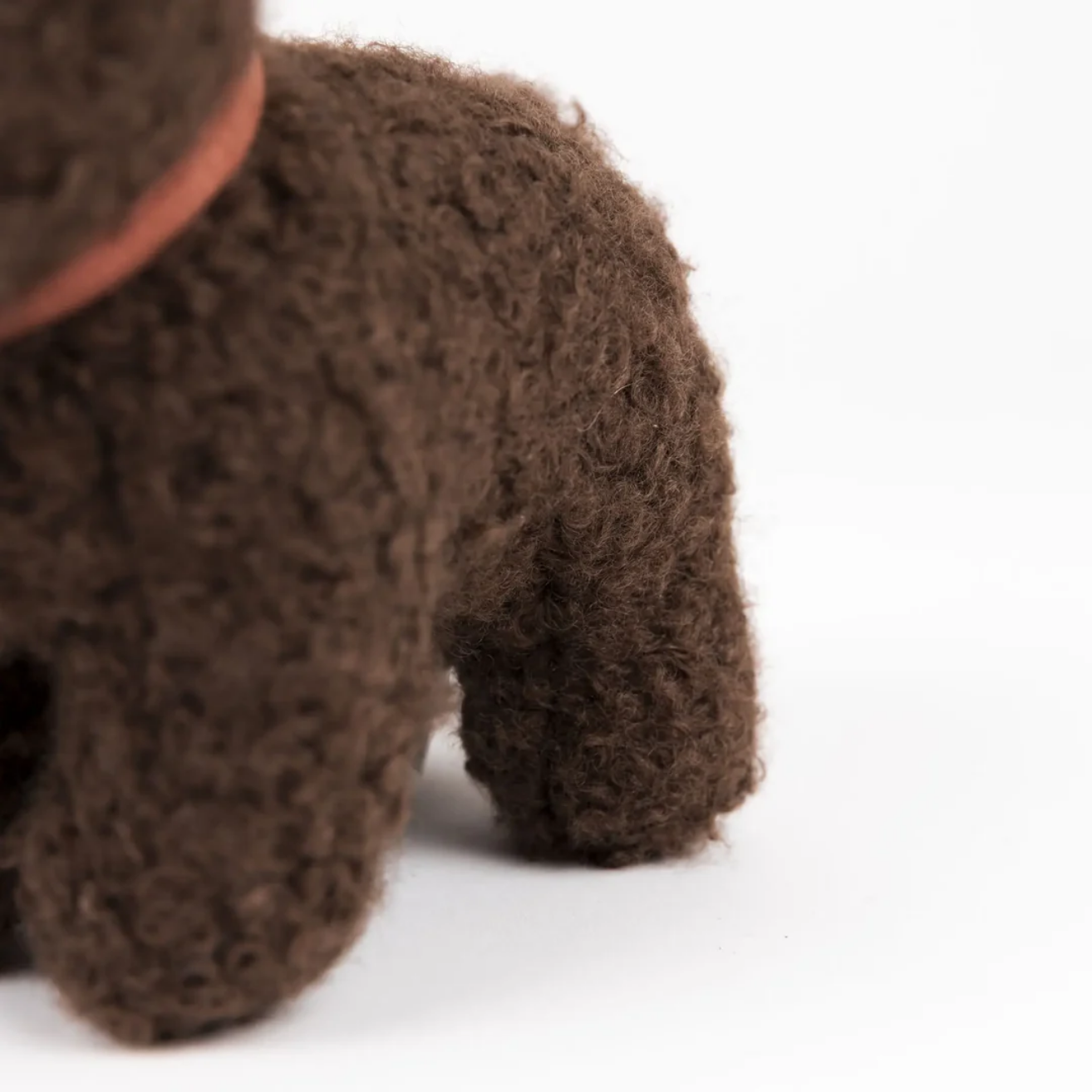 Close-up of a brown plush toy on a white background