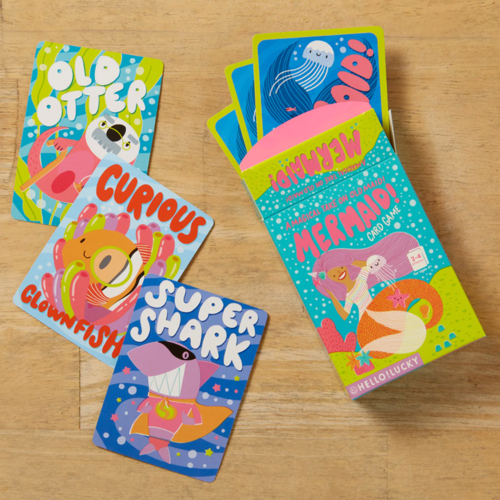 Colorful children's books on a wooden surface