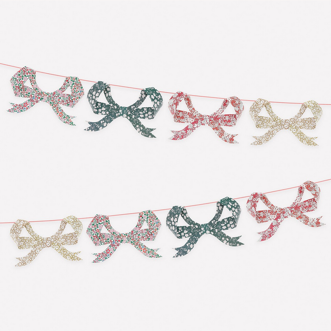 Decorative garland with colorful bows on a white background