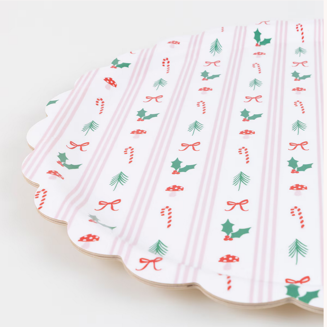 Decorative paper plates with Christmas-themed patterns on a white background