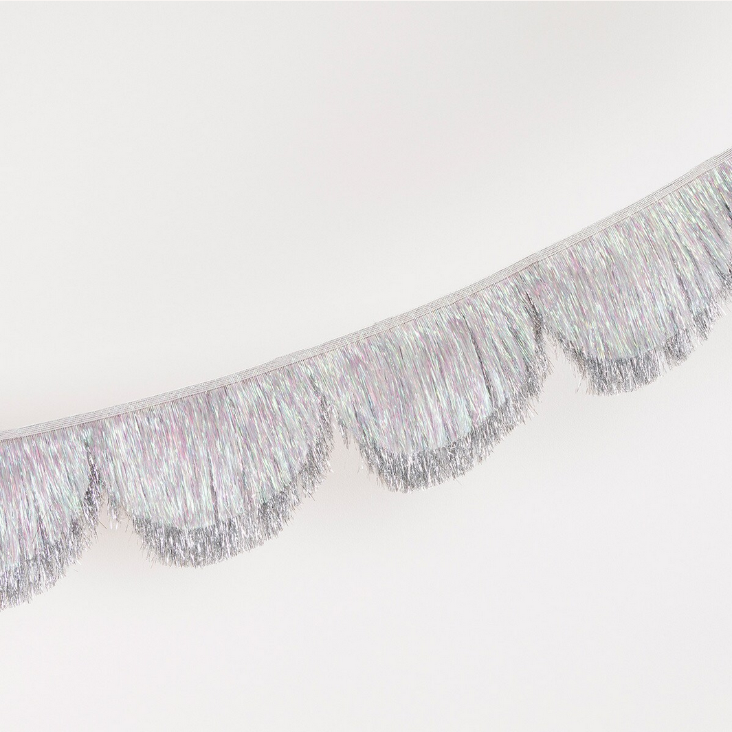 Silver tinsel fringe on a white background