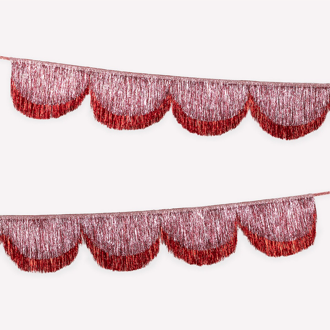 Red metallic fringe curtain on a white background