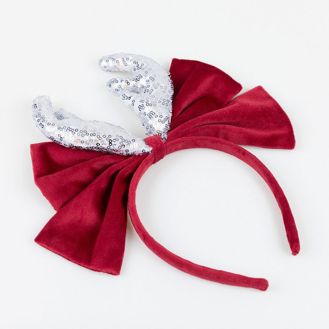Red headband with a large bow and white sequin bow on a white background