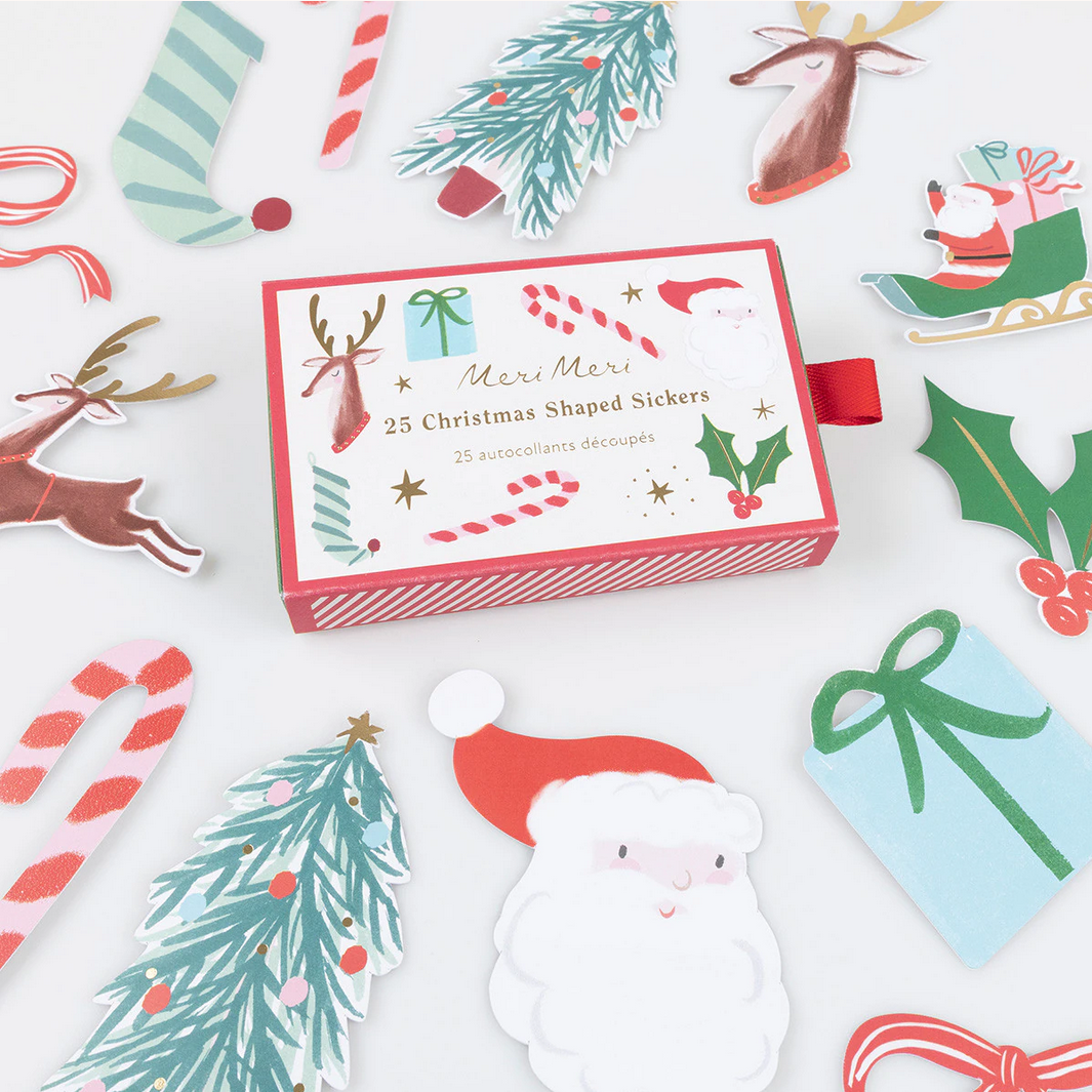 Box of Christmas-themed stickers with various designs on a white background