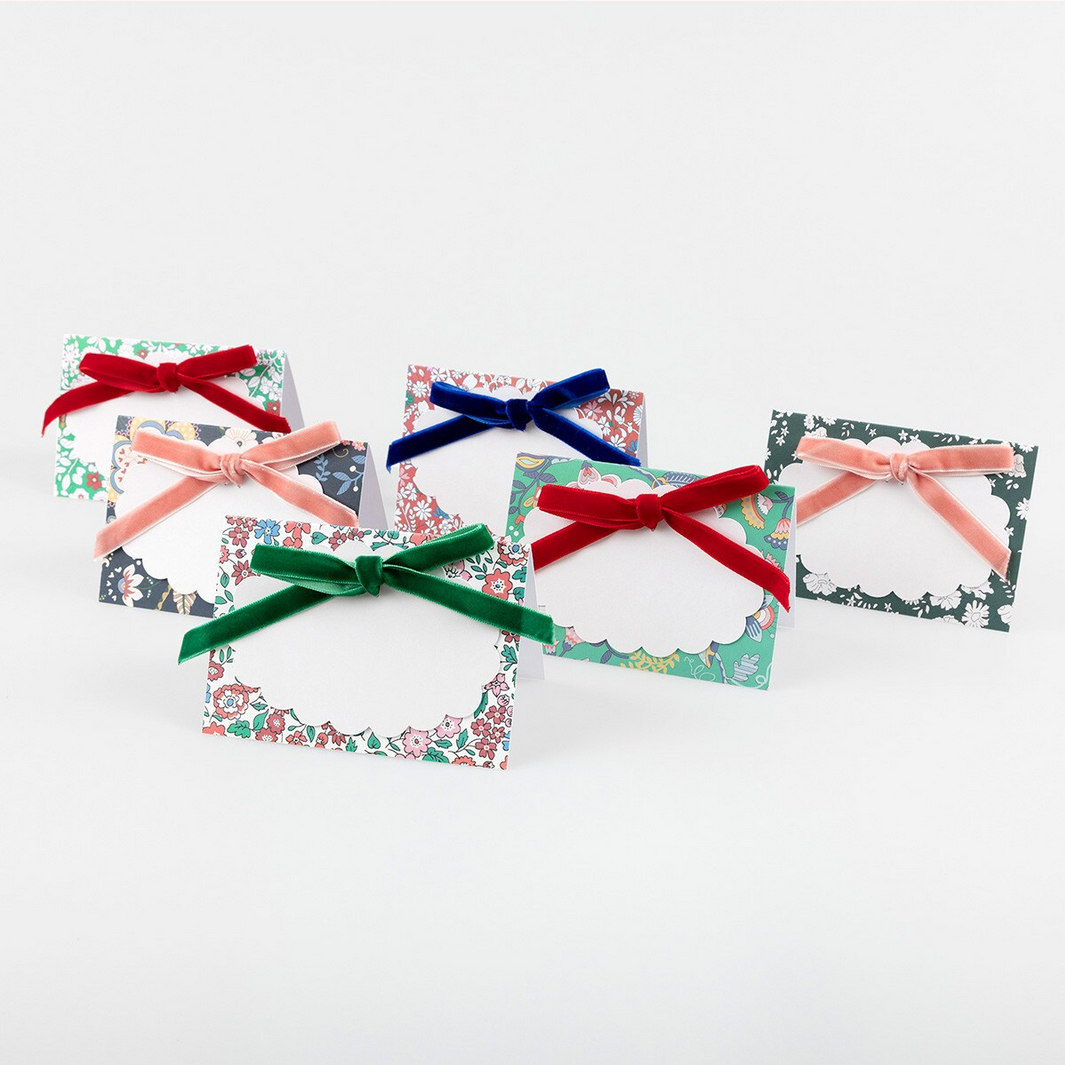 Five decorative cards with colorful ribbons on a white background