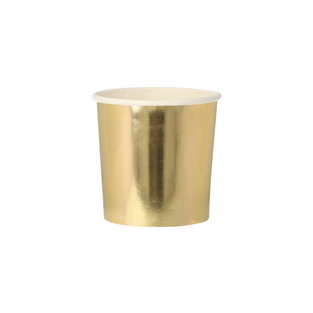 Gold metallic cup on a white background