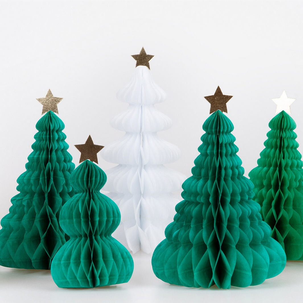 Set of green paper Christmas trees with star toppers on a white background
