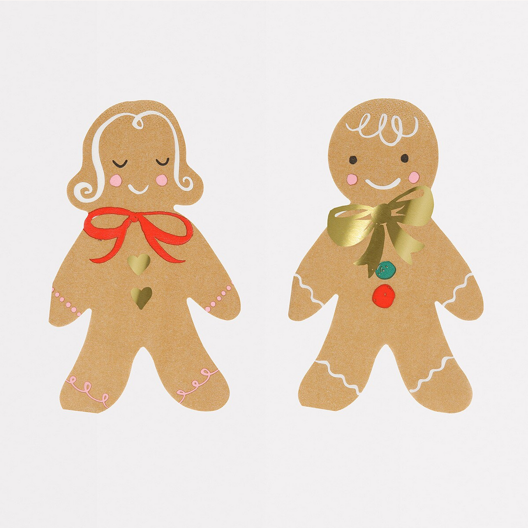 Two gingerbread people napkins with decorative ribbons and buttons on a light gray background
