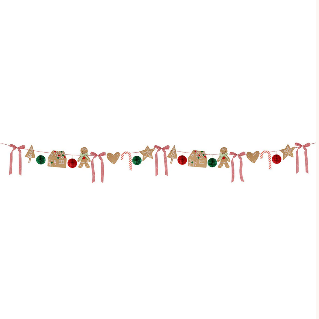 Decorative string with gingerbread men, candy canes, and ribbons on a white background