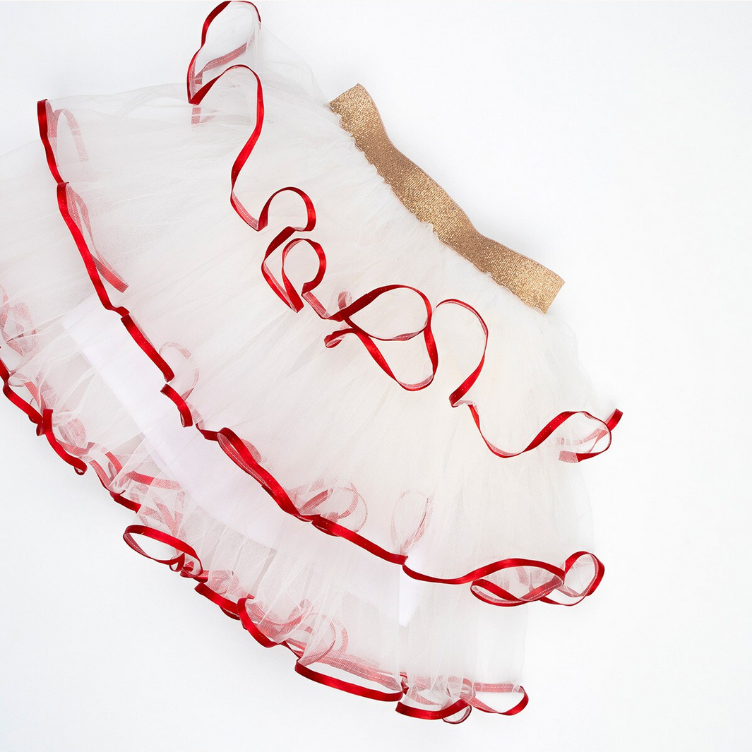White dress with red trim and a gold belt on a white background