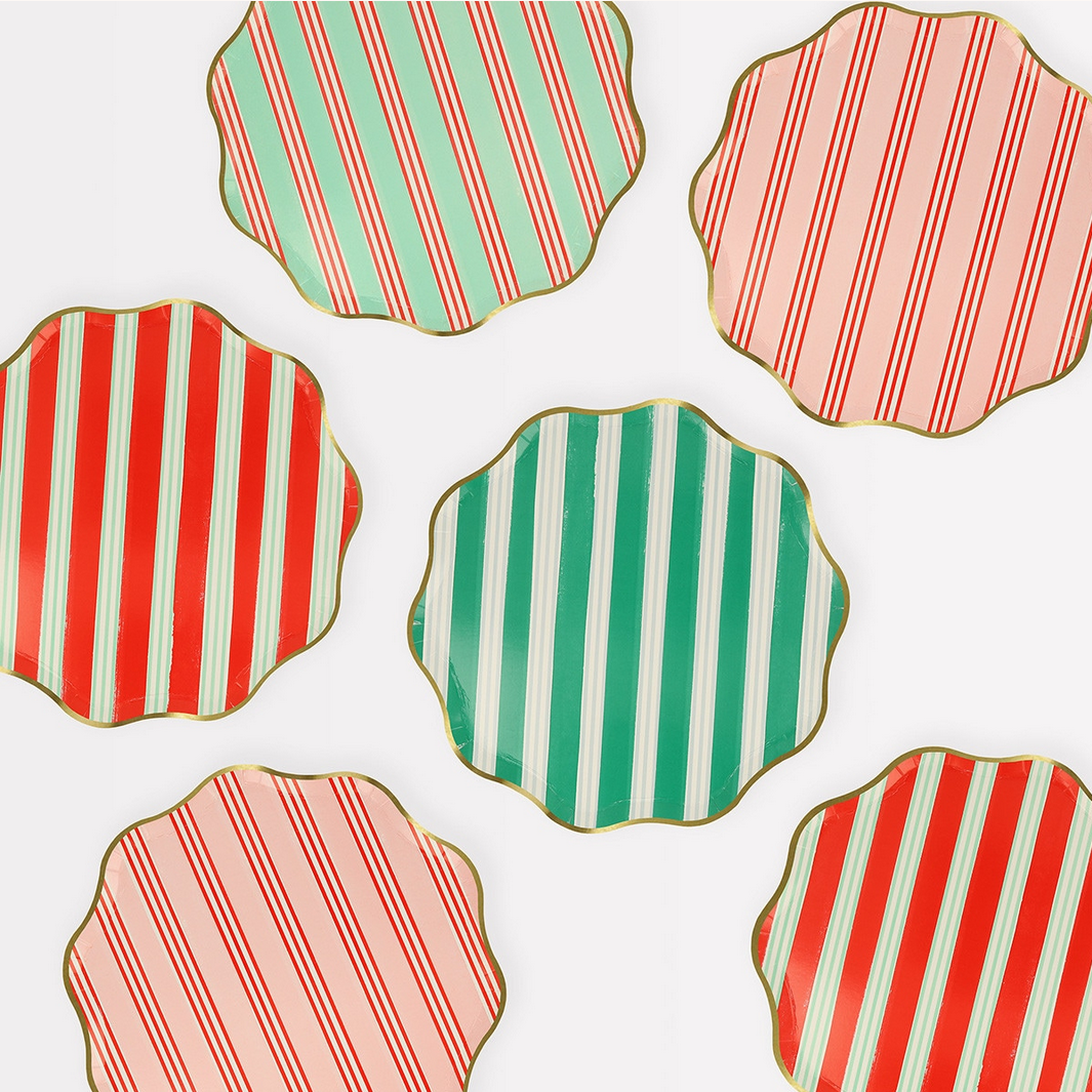 Hexagonal plates with red, green, and pink striped patterns on a white background