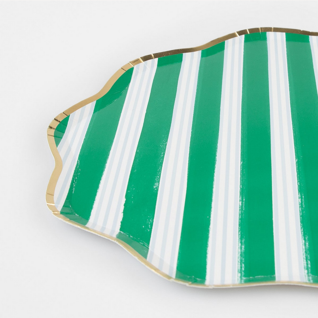 Green and white striped dish on a white background