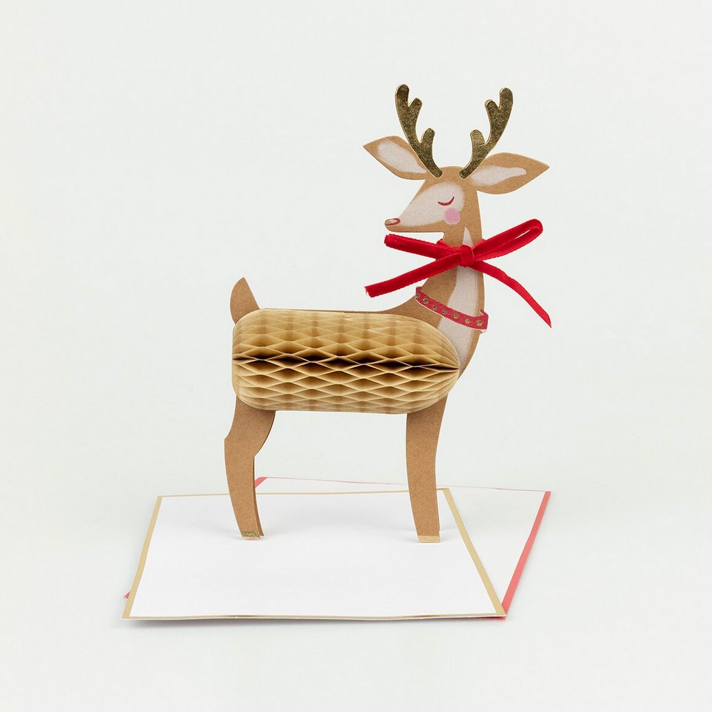 3D paper reindeer with a red bow on a white background