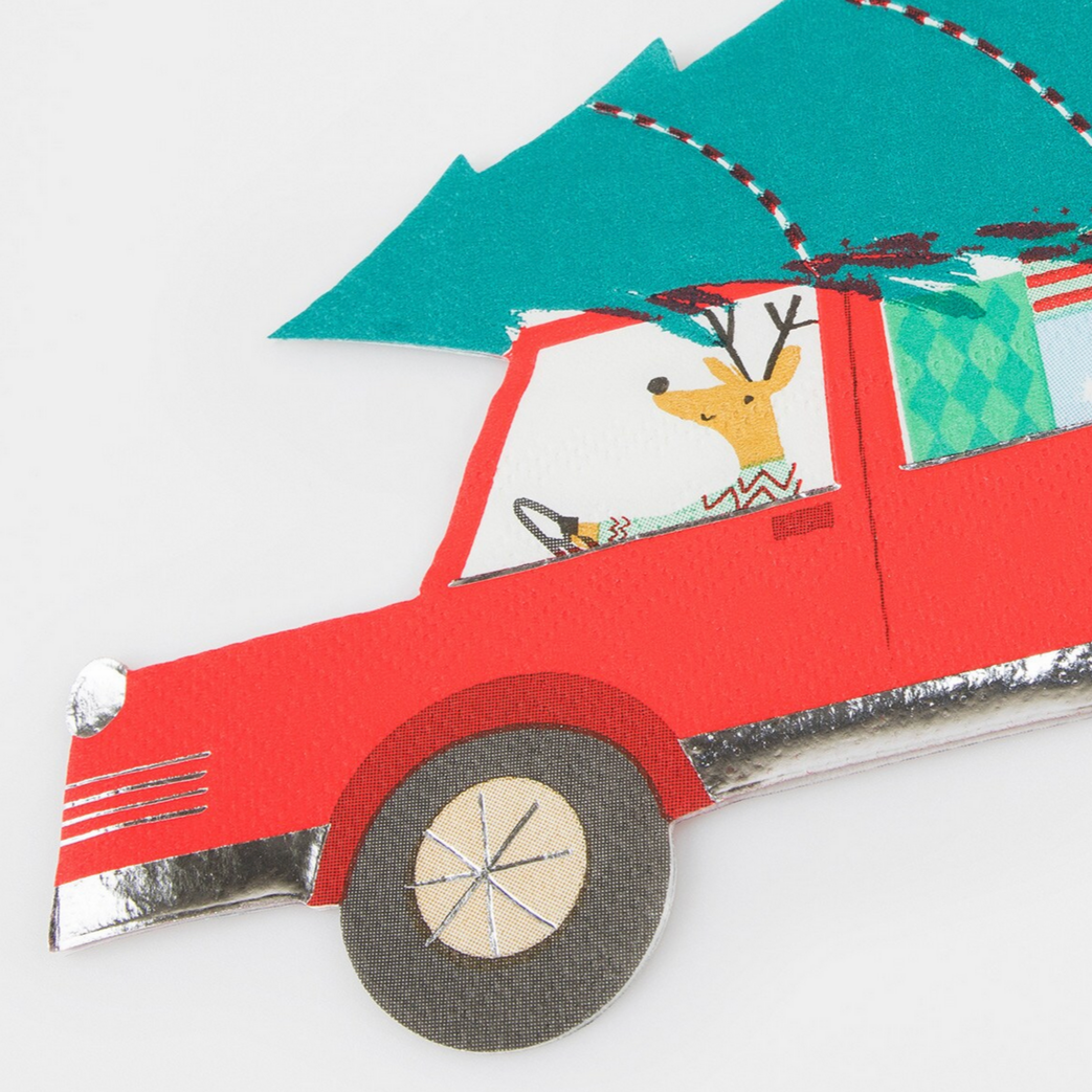 Red car with a reindeer driver and Christmas tree on a white background