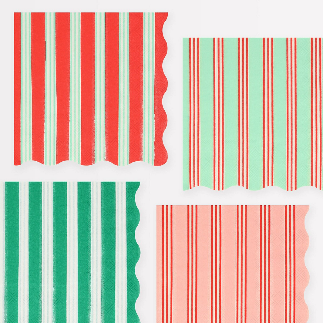 Set of red, green, and pink striped paper squares on a white background