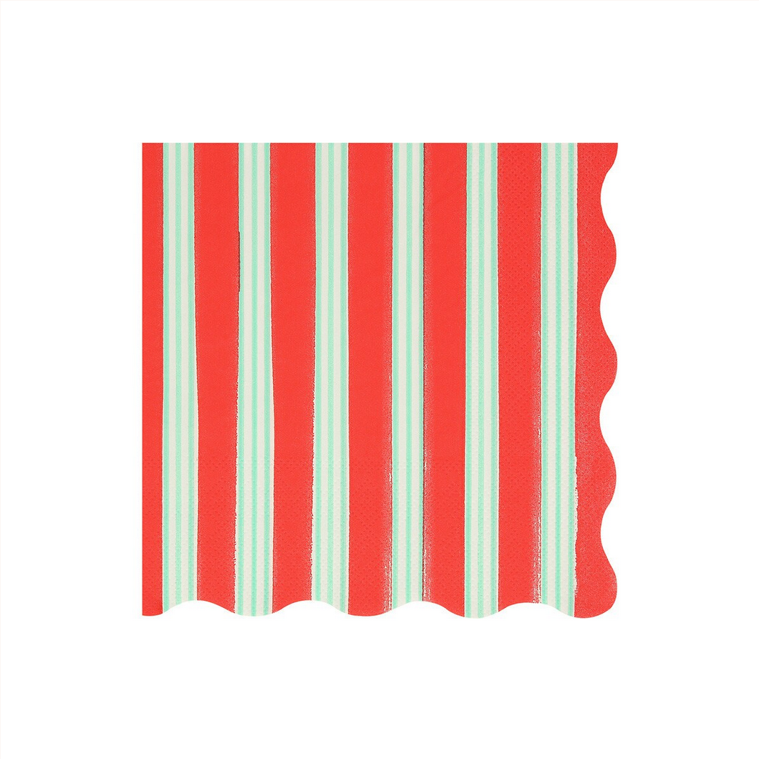 Red and green striped napkin with scalloped edges on a white background