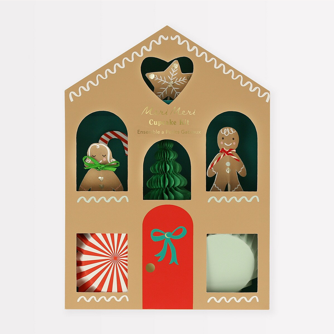 Gingerbread-themed gift set in a decorative box with a red door and various gingerbread figures inside.